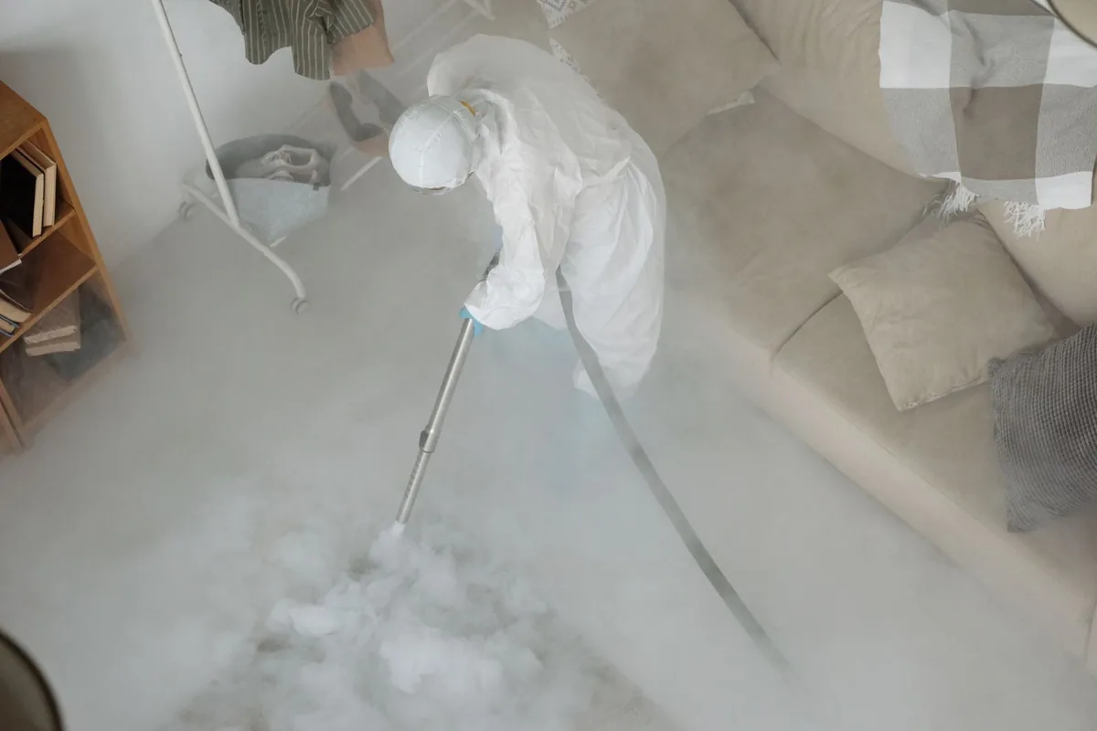 Biohazard cleanup technician in protective equipment, Centerville, OH